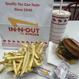 Double cheeseburger with fries and vanilla shake.