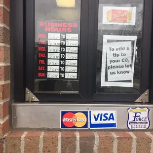 ows a business sign in a window