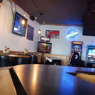 a bar with a row of chairs