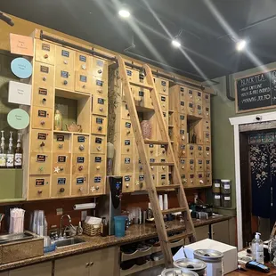 a coffee shop with a ladder leaning against the wall