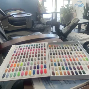Inside of shop on the chair with color choices for nails