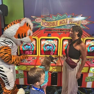 a woman in a tiger costume and a child in a costume