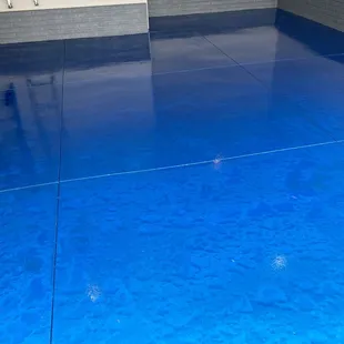 a shiny blue floor