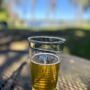 a glass of beer on a table