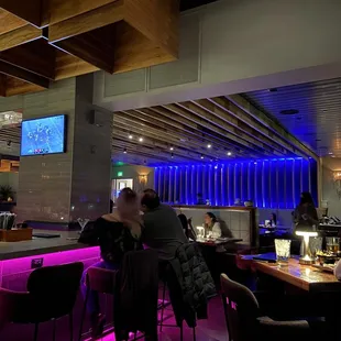 people sitting at a bar