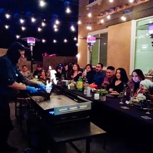 a group of people sitting around a table