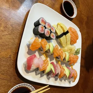 First row: Spicy Tuna roll, omelette nigiri, spicy salmon nigiri. Middle special roll: pink dragon, Last roll: rainbow roll (so good)