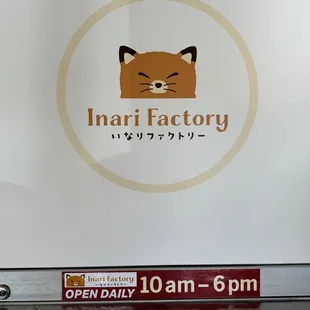 an open daily sign with a picture of a cat