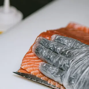 a piece of salmon on a cutting board