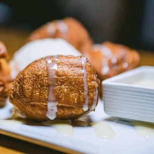 a plate of doughnuts with icing