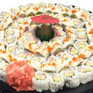 a plate of sushi with a red umbrella