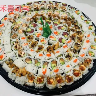 a large platter of sushi