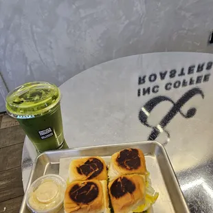 Breakfast rolls (4 kings Hawaiian rolls, 2 scrambled eggs, avocado, cheddar cheese, and a side of 919 sauce) + Matcha Lemonade