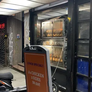 a sign in front of a restaurant