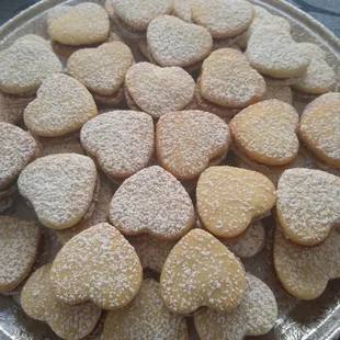 a plate of heart shaped cookies