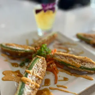 a plate of fried zucchini on a table