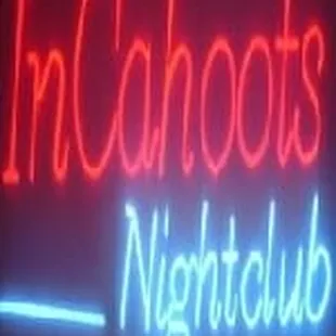 a neon sign for a night club