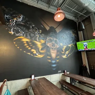 a mural of a butterfly on the wall