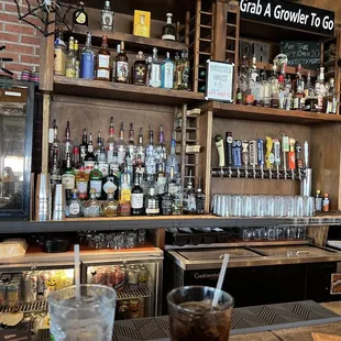 a bar with a variety of liquors