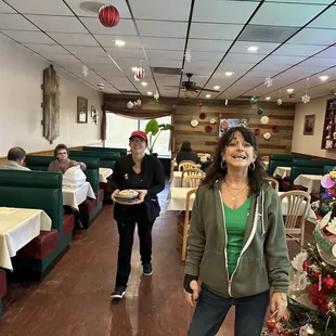 a woman standing in a restaurant