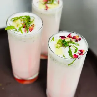 a close up of two glasses of a drink