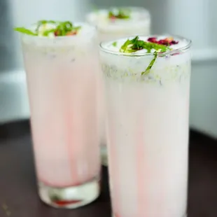 a close up of two glasses of a drink