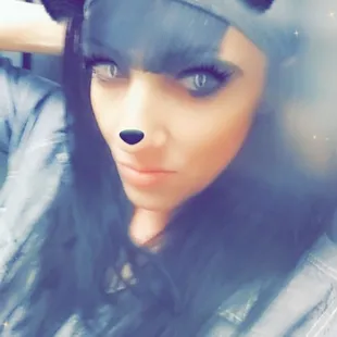 a woman wearing a panda mask