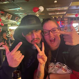 a man and a woman posing for a picture