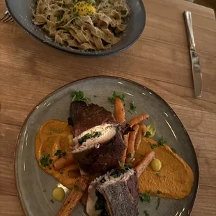 Prosciutto wrapped spinach filled NC Trout. Served on a smoky romesco and wood fired carrots. The pasta is a Black Pepper Tagliatelle.