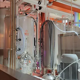 a row of stainless steel tanks