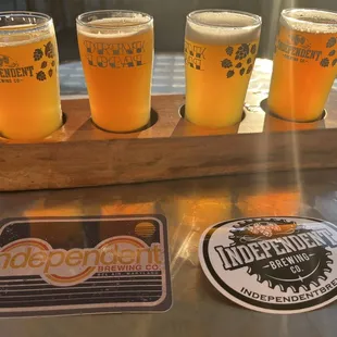 A great flight of IPA's and a couple stickers for the beer wall back home