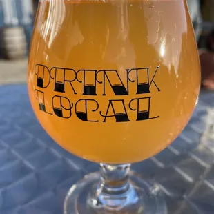 a glass of beer on a table