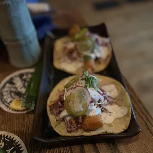 three tacos on a tray