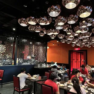 a group of people eating at a restaurant