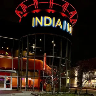 the entrance to a mall at night