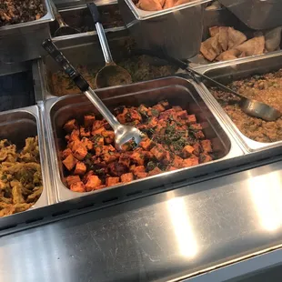 a variety of food items in a buffet