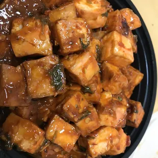 a bowl of tofu with sauce