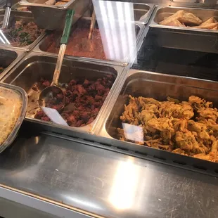 a variety of food items in a buffet