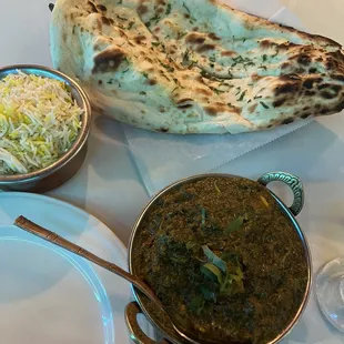 a plate of food and a naan