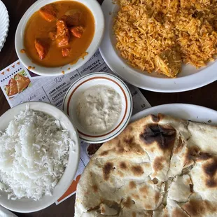 Butter chicken. Chicken Biryani. Garlic naan. Raita.