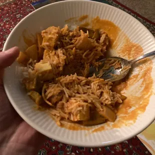a person holding a bowl of food