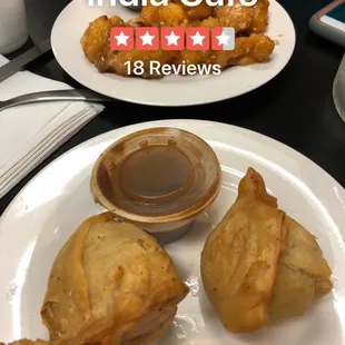 a plate of fried food and a cup of coffee