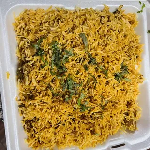 a close up of a take out container of food