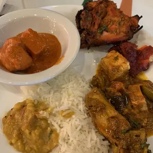 a plate of food with rice and meat
