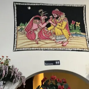 a painting on the wall of a restaurant