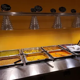 a variety of food in a buffet