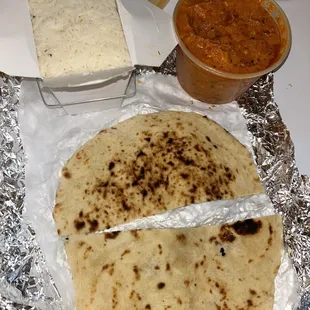 Butter chicken and cheese naan with a side of rice