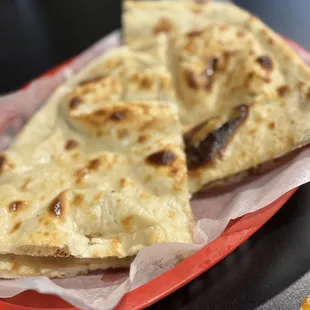Fresh baked naan served with the lunch buffet. Luv this stuff! Crisp edges, fluffy inside.