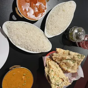 Chicken tikka masala and mutter paneer. Each dish came with one side of rice, two garlic naan orders pictured