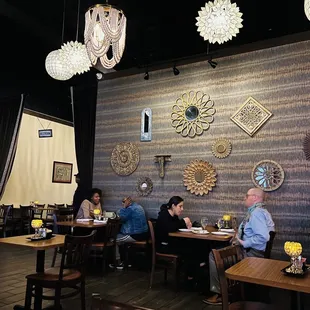 people sitting at tables in a restaurant